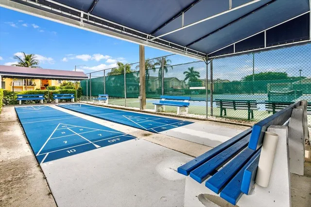a view of swimming pool with a patio