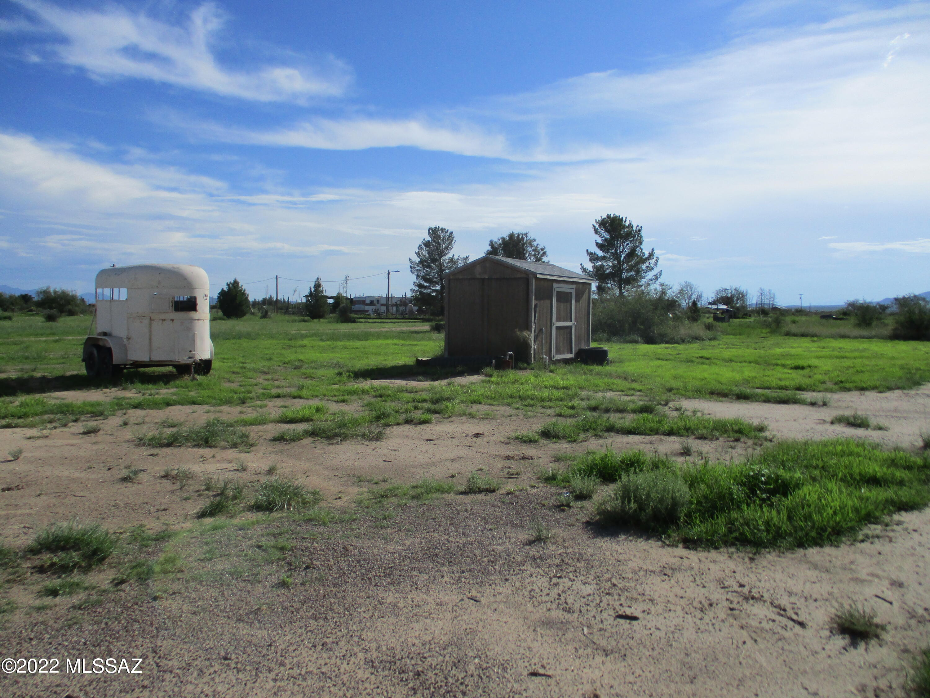 1453 North Taylor Road Willcox, AZ 85643 - Photo 26 of 31 a view of a field with an houses
