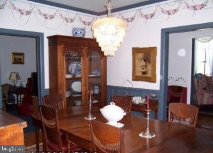 15770 Bassford Road Waldorf, MD 20601 - Photo 2 of 16 a view of a dining room with furniture and chandelier