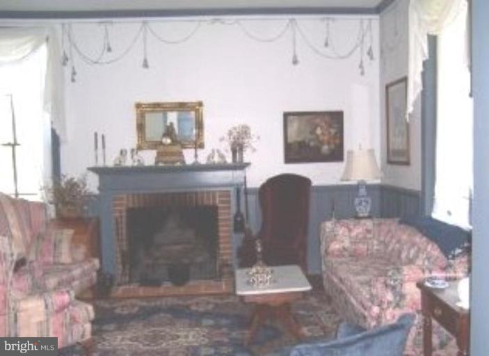 15770 Bassford Road Waldorf, MD 20601 - Photo 12 of 16 a living room with furniture and a fireplace