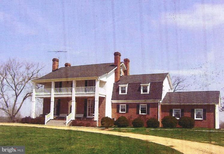 15770 Bassford Road Waldorf, MD 20601 - Photo 16 of 16 front view of a brick house with a yard