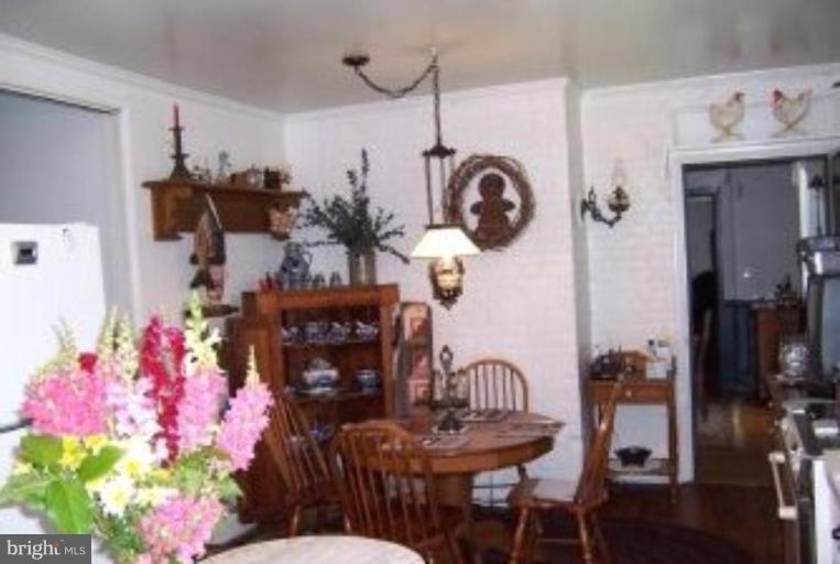 15770 Bassford Road Waldorf, MD 20601 - Photo 5 of 16 a view of a dining room with furniture and chandelier
