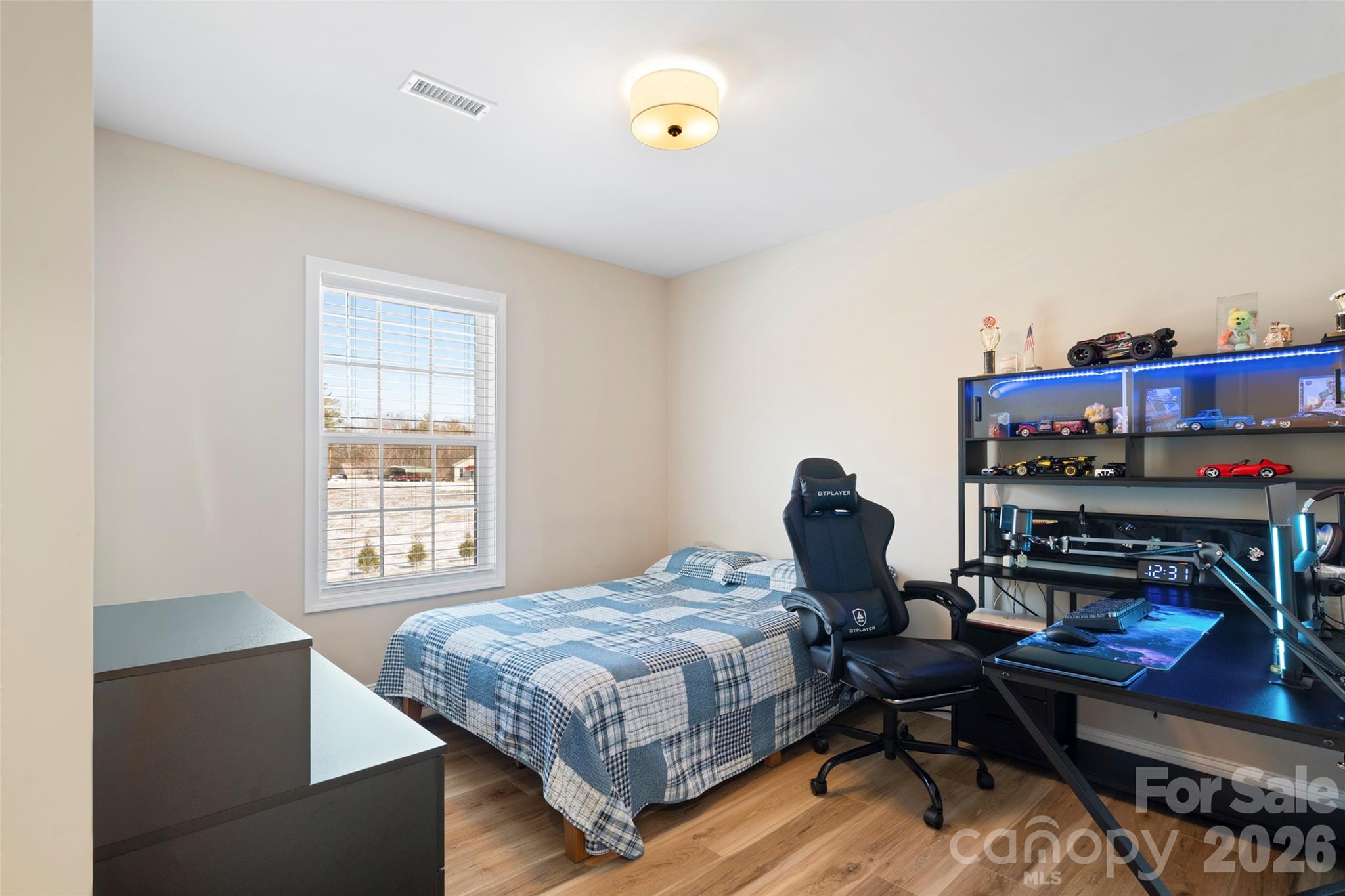5961 Charlie Little Road Granite Falls, NC 28630 - Photo 11 of 29 a bedroom with a bed a table and chair
