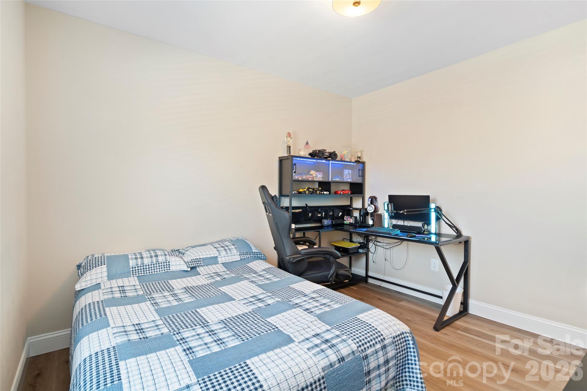 5961 Charlie Little Road Granite Falls, NC 28630 - Photo 12 of 29 a bedroom with a bed a desk and chair