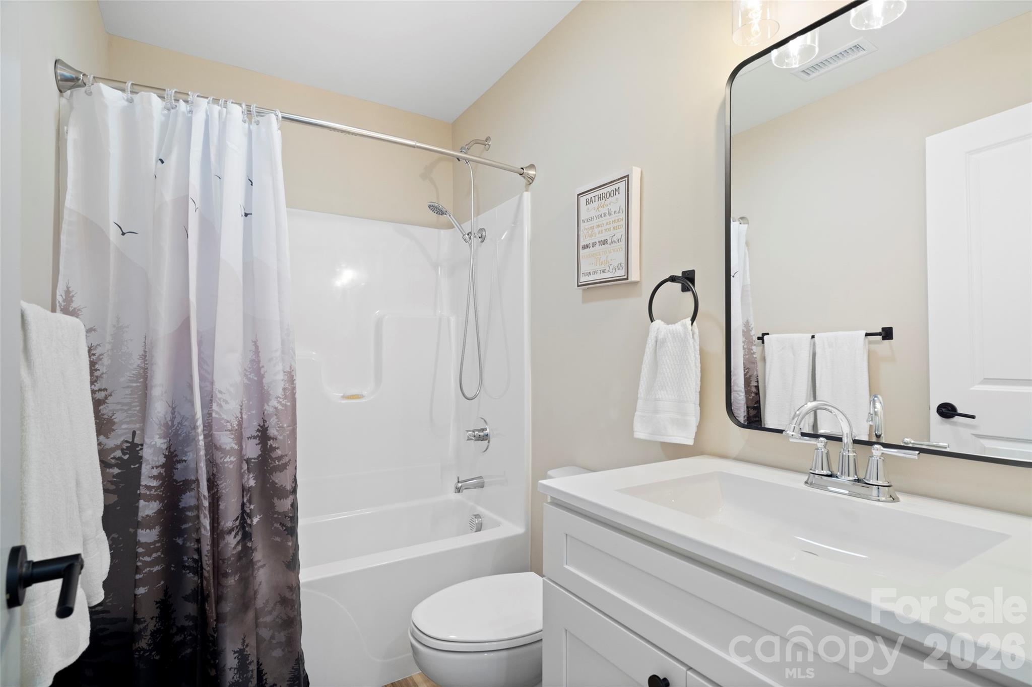 5961 Charlie Little Road Granite Falls, NC 28630 - Photo 13 of 29 a bathroom with a granite countertop sink a toilet and shower