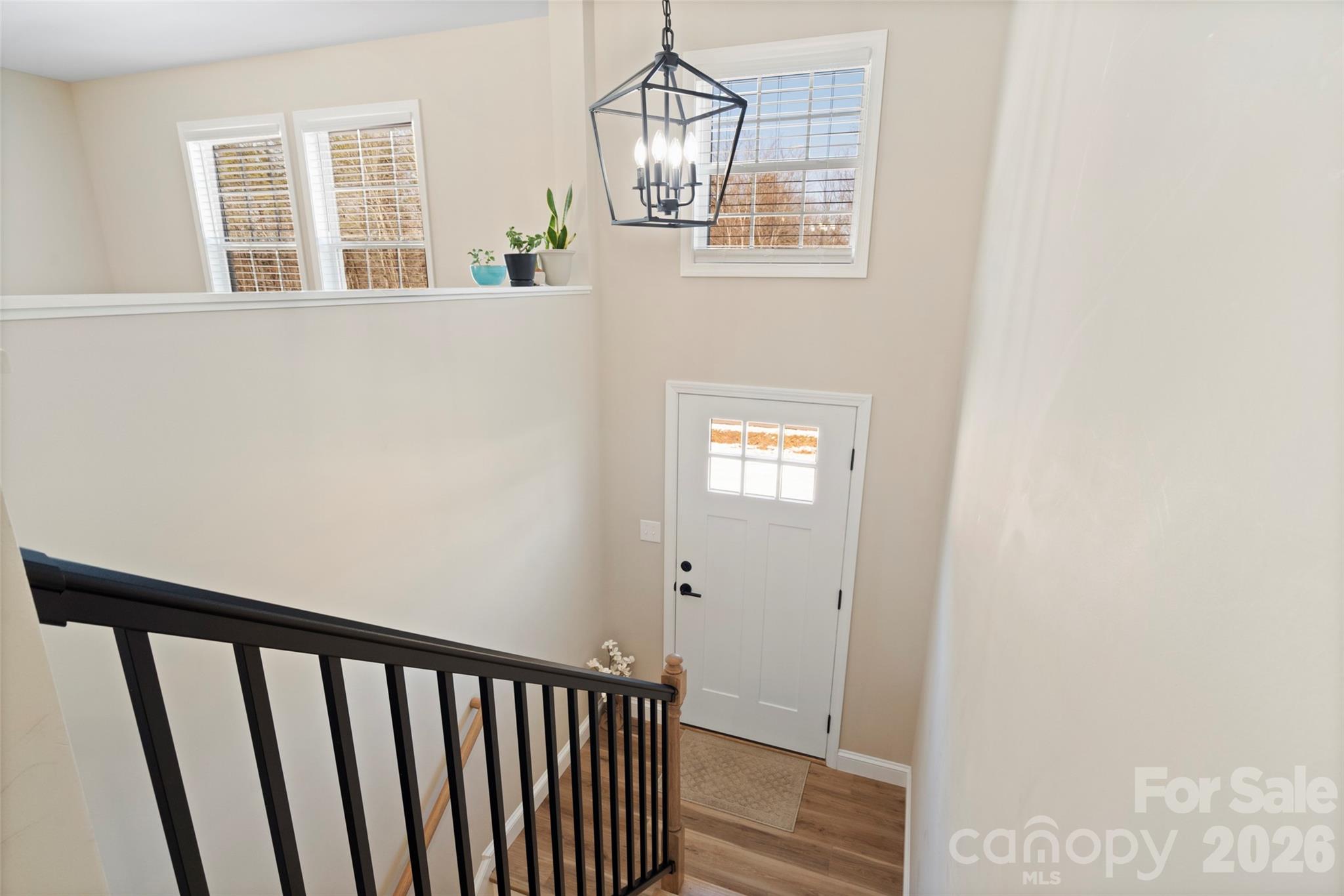 5961 Charlie Little Road Granite Falls, NC 28630 - Photo 20 of 29 a view of a hallway with wooden floor and windows