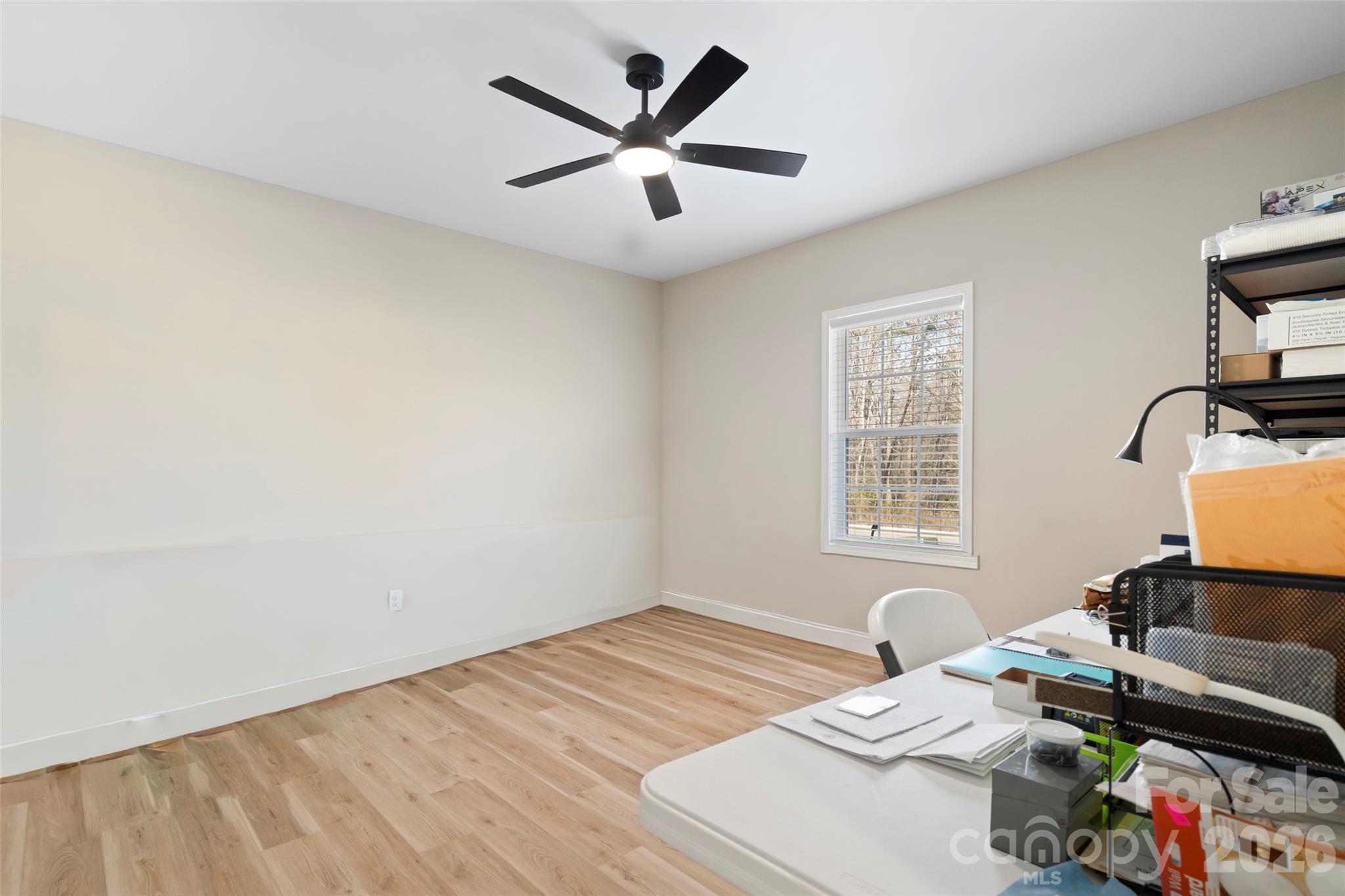 5961 Charlie Little Road Granite Falls, NC 28630 - Photo 22 of 29 a bed room with a bed window and a chair