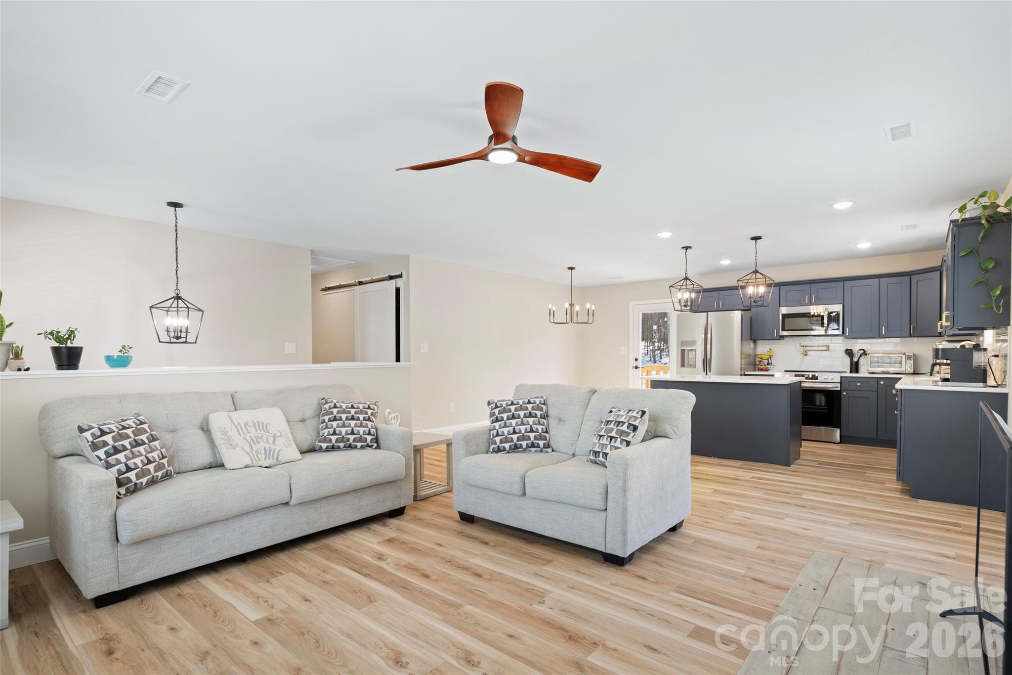 5961 Charlie Little Road Granite Falls, NC 28630 - Photo 7 of 29 a living room with furniture and kitchen view