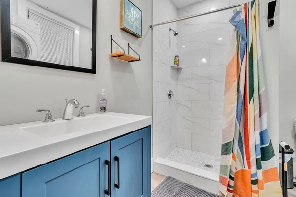 a bathroom with a sink and a mirror