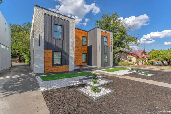 a street view with residential house and street