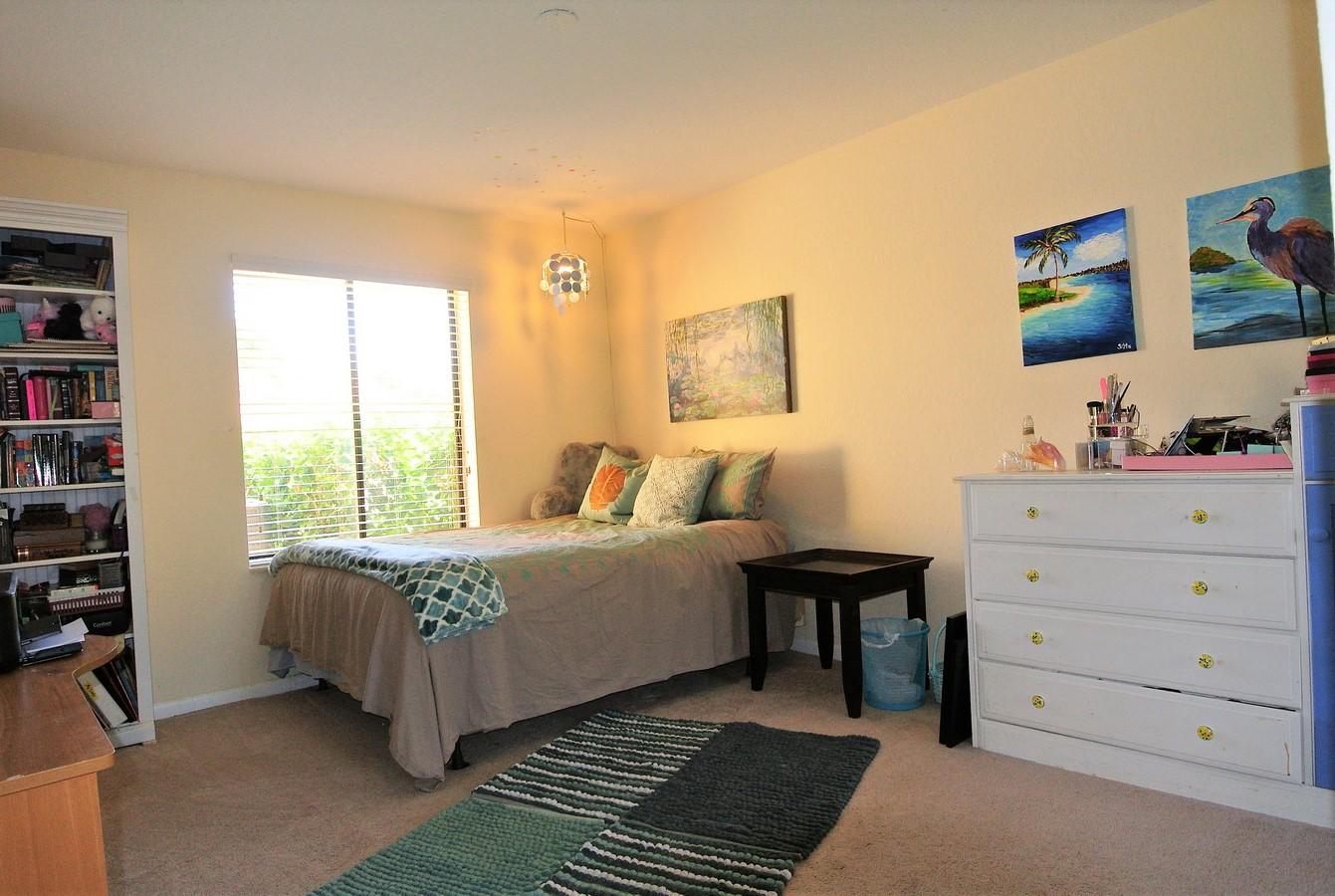200 Ridge Road Jupiter, FL 33477 - Photo 12 of 18 a bedroom with a bed and a window