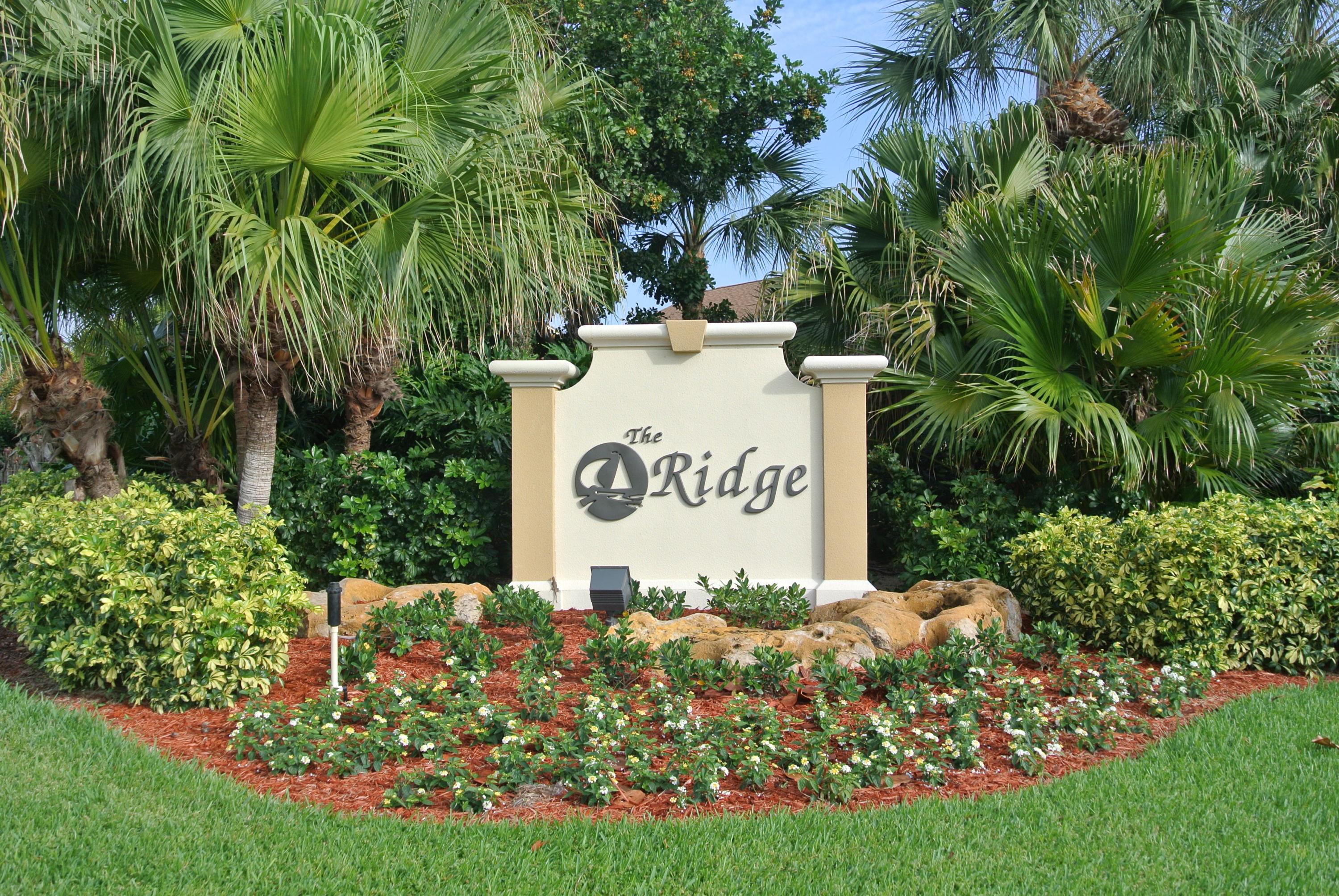 200 Ridge Road Jupiter, FL 33477 - Photo 16 of 18 a sign of golf club on a wall under a tree