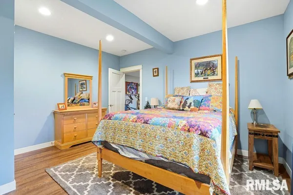 a bed room with a bed and a television