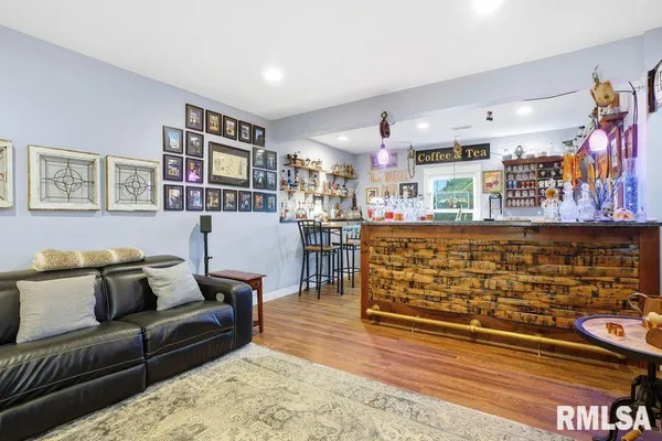 a living room with furniture and a rug