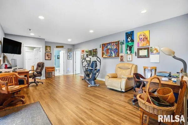 a view of a livingroom with furniture and a flat screen tv