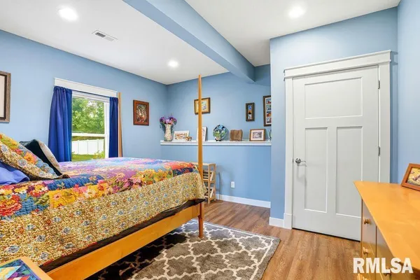 a bed room with a bed and a couch