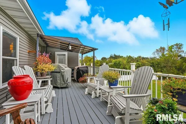 a view of balcony with furniture