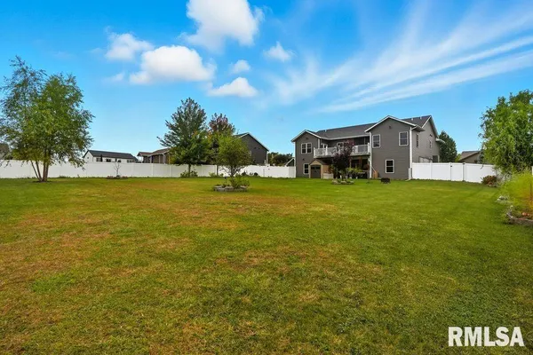 a view of a house with a big yard