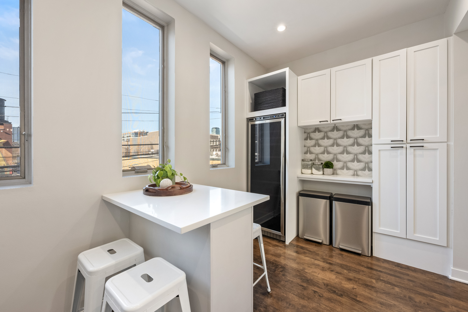 1236 West Cottage Place, Unit 1236 Chicago, IL 60607 - Photo 11 of 24 a kitchen with stainless steel appliances a white stove top oven and a refrigerator