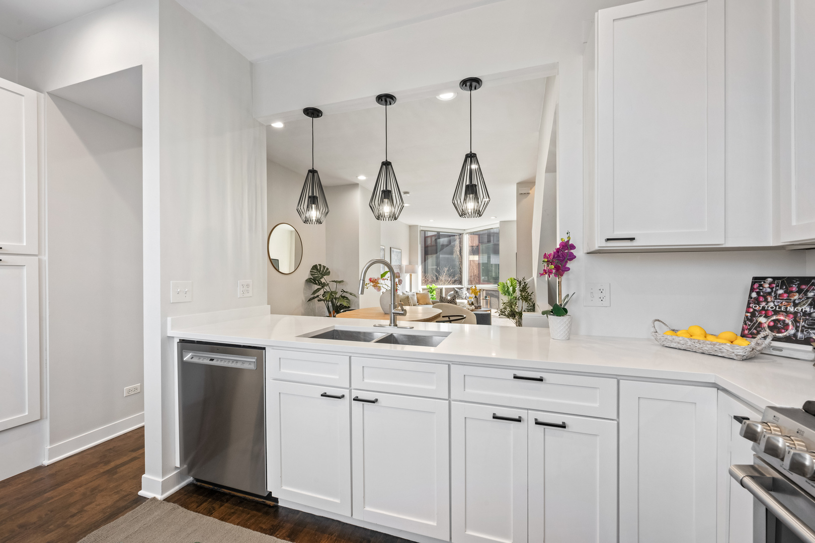 1236 West Cottage Place, Unit 1236 Chicago, IL 60607 - Photo 12 of 24 a kitchen with white cabinets and a sink