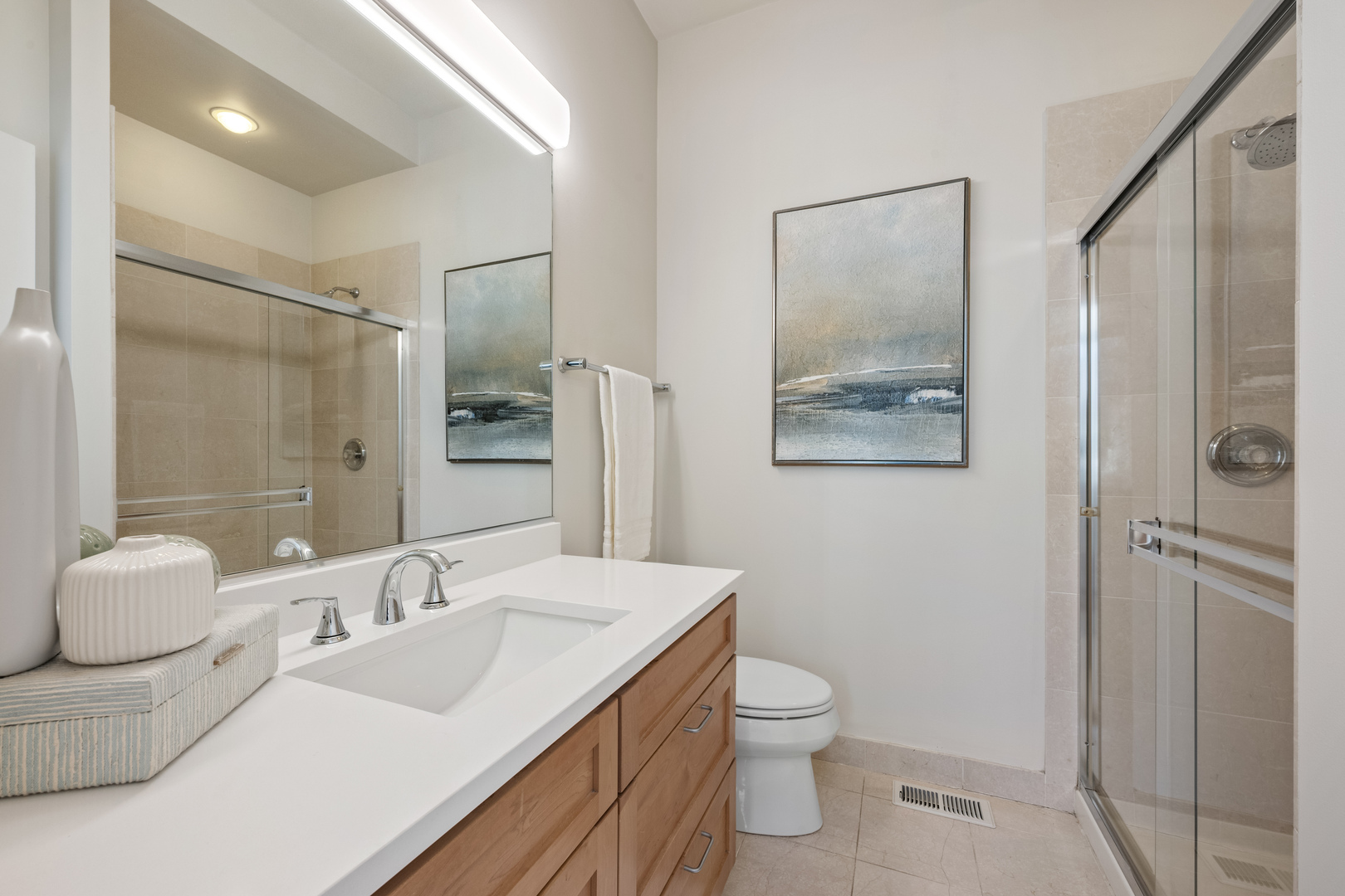 1236 West Cottage Place, Unit 1236 Chicago, IL 60607 - Photo 17 of 24 a bathroom with a sink toilet and shower