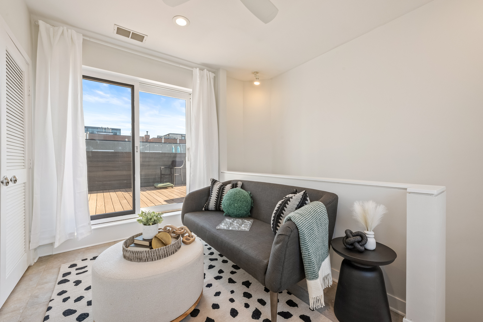 1236 West Cottage Place, Unit 1236 Chicago, IL 60607 - Photo 22 of 24 a living room with furniture and a window