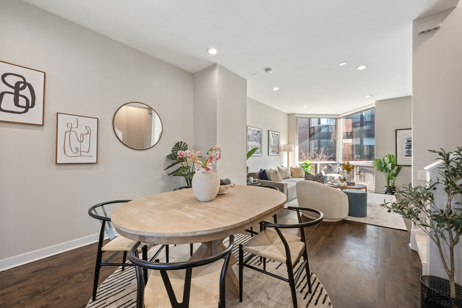 1236 West Cottage Place, Unit 1236 Chicago, IL 60607 - Photo 6 of 24 a view of a dining room with furniture and wooden floor