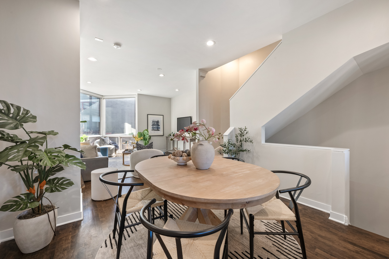 1236 West Cottage Place, Unit 1236 Chicago, IL 60607 - Photo 7 of 24 a view of a dining room with furniture and wooden floor