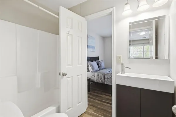 a bathroom with a bathtub and a shower