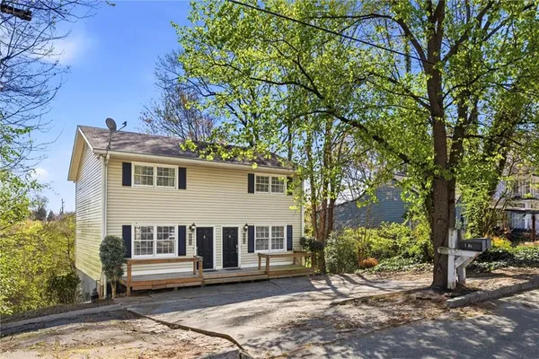 a outdoor view of a house with a backyard