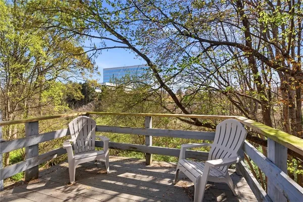 a view of a chairs and table in the patio