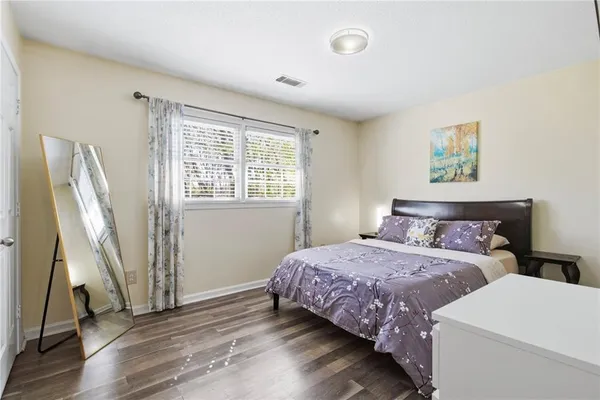 a bedroom with double bed and a window