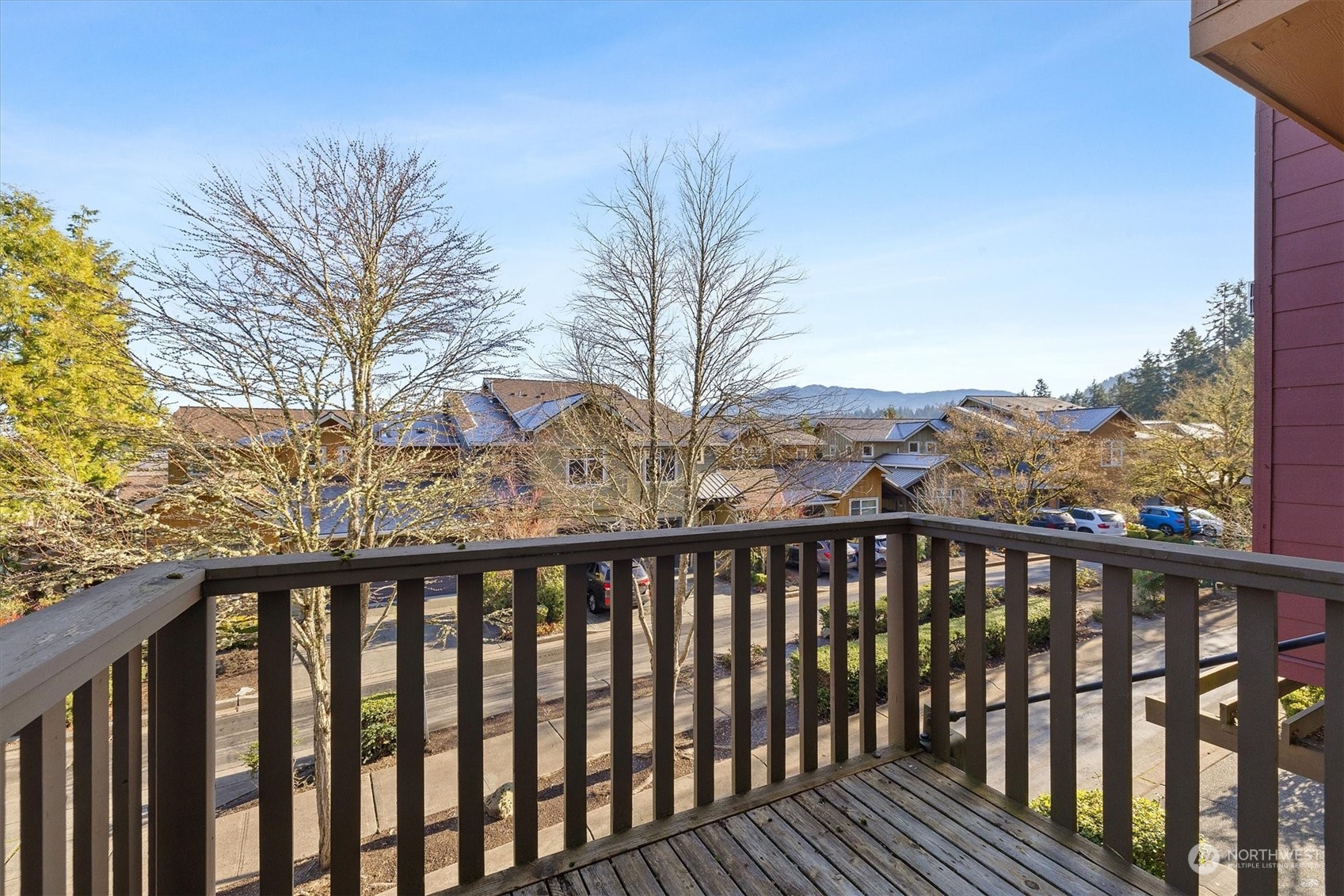 103 Sky Ridge Road Northwest Issaquah, WA 98027 - Photo 17 of 37 a balcony with wooden floor and fence