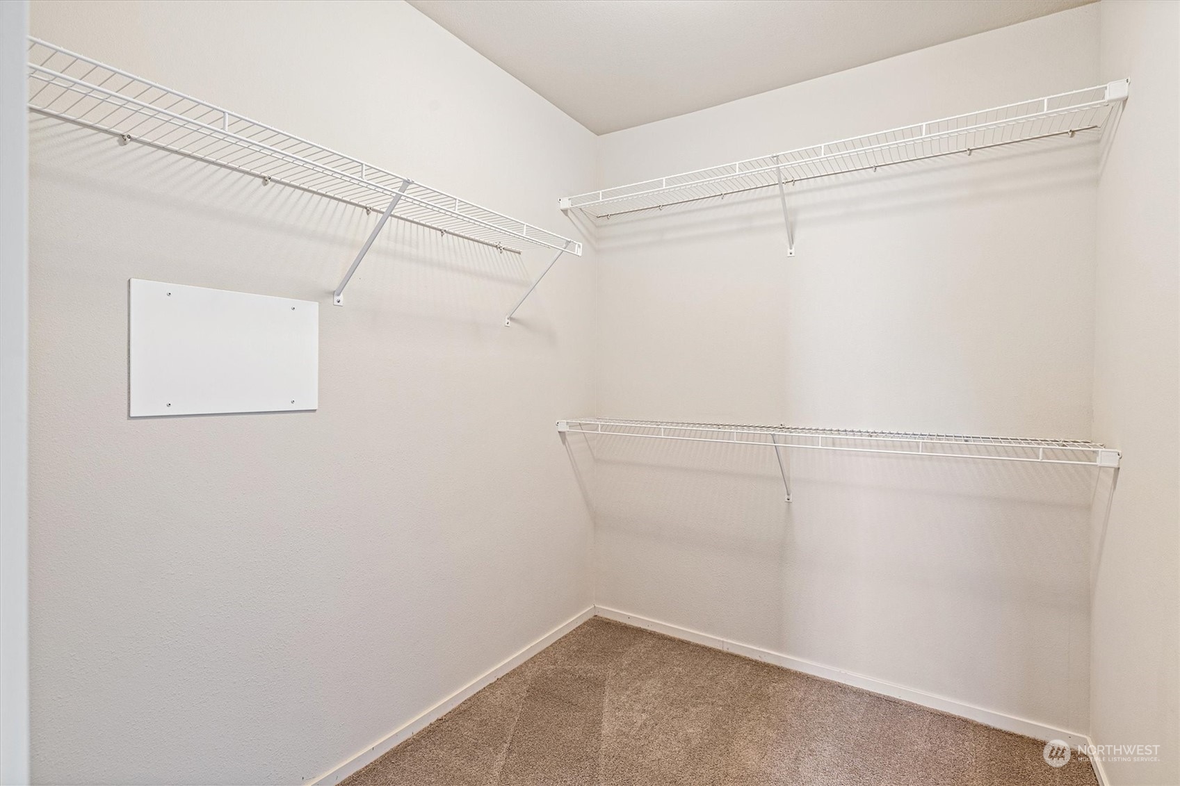 103 Sky Ridge Road Northwest Issaquah, WA 98027 - Photo 19 of 37 a view of a room with racks on the wall