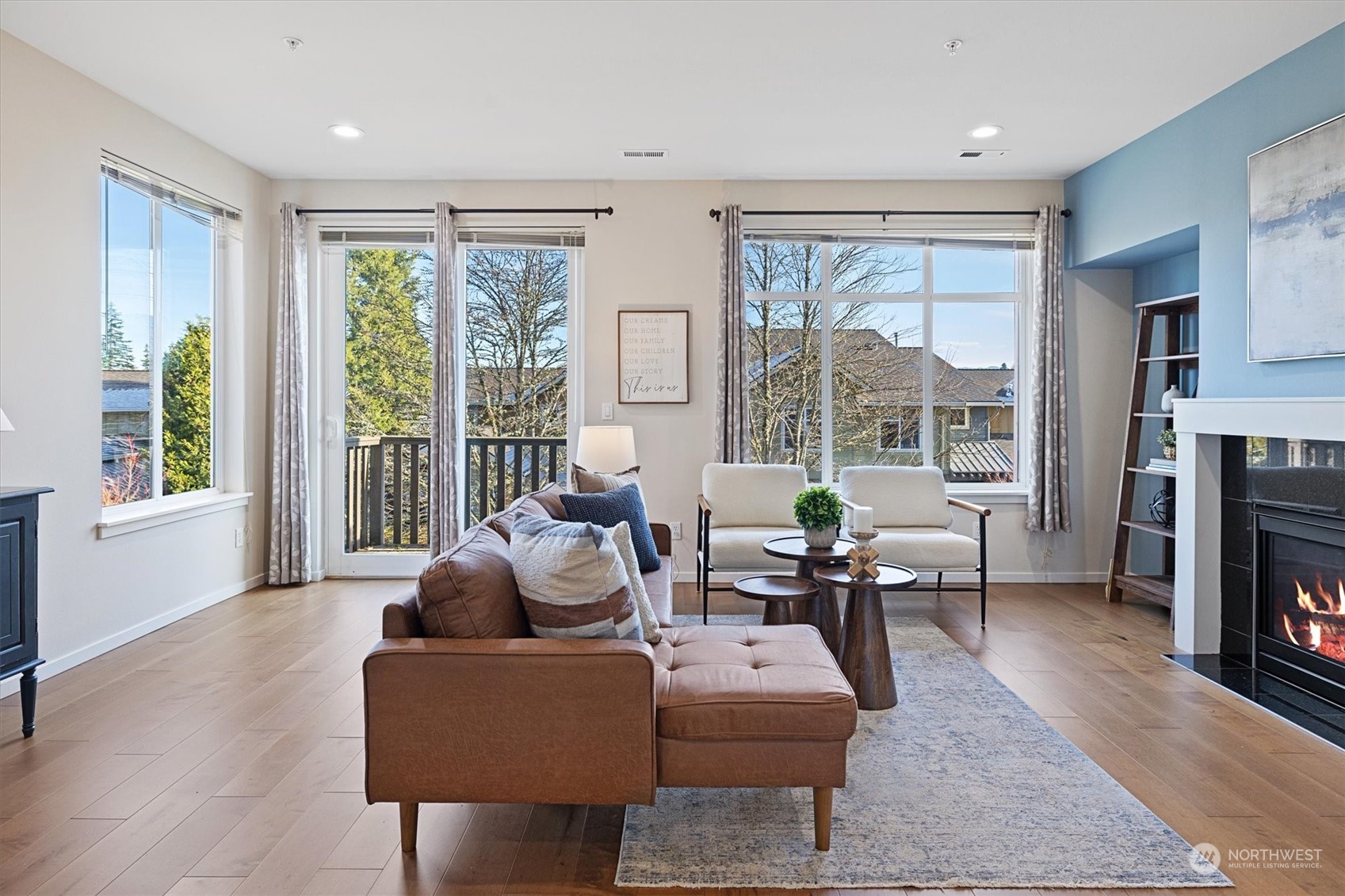 103 Sky Ridge Road Northwest Issaquah, WA 98027 - Photo 5 of 37 a living room with fireplace furniture and a large window