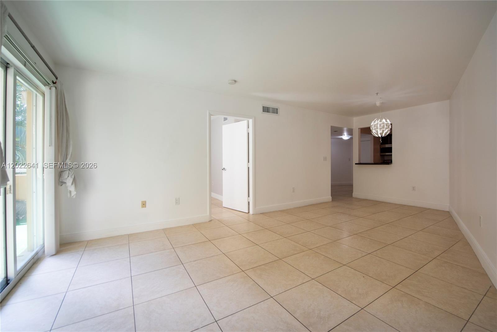 4147 Stirling Road, Unit 105 Dania Beach, FL 33314 - Photo 9 of 16 an empty room with windows