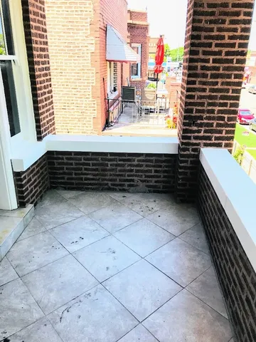 a bathroom with a bathtub and a window