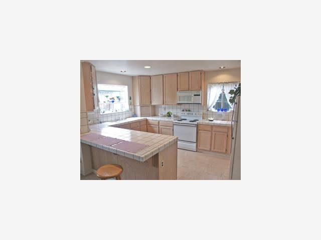 428 Bella Corte Mountain View, CA 94043 - Photo 4 of 9 a kitchen with a sink and cabinets