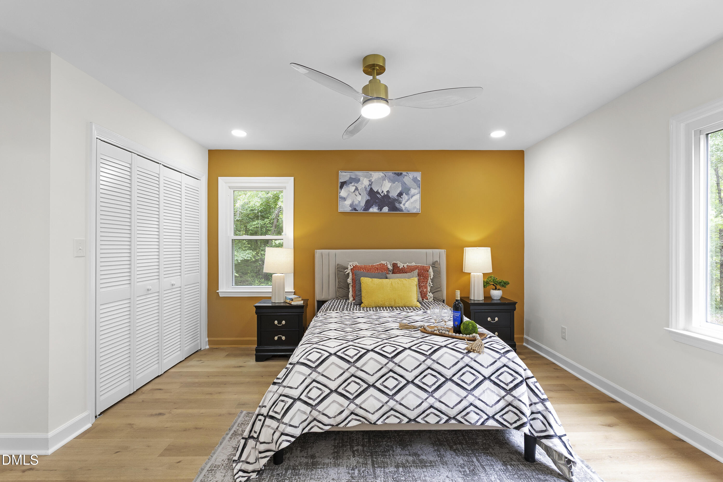 2168 Lakewood Falls Road Goldston, NC 27252 - Photo 14 of 30 a bedroom with a bed and wooden floor
