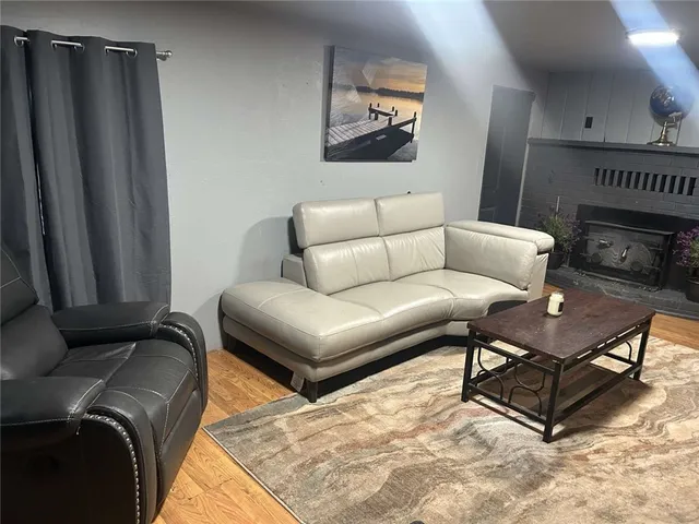 a living room with furniture a couch and a piano