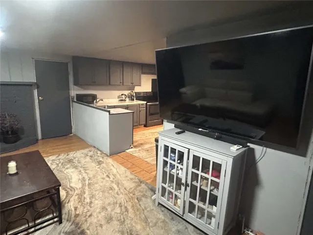 a kitchen with a stove and a microwave