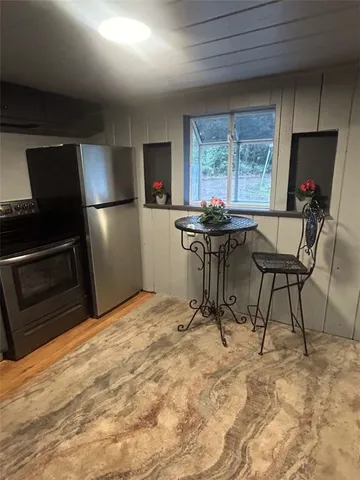 a view of a workspace with furniture