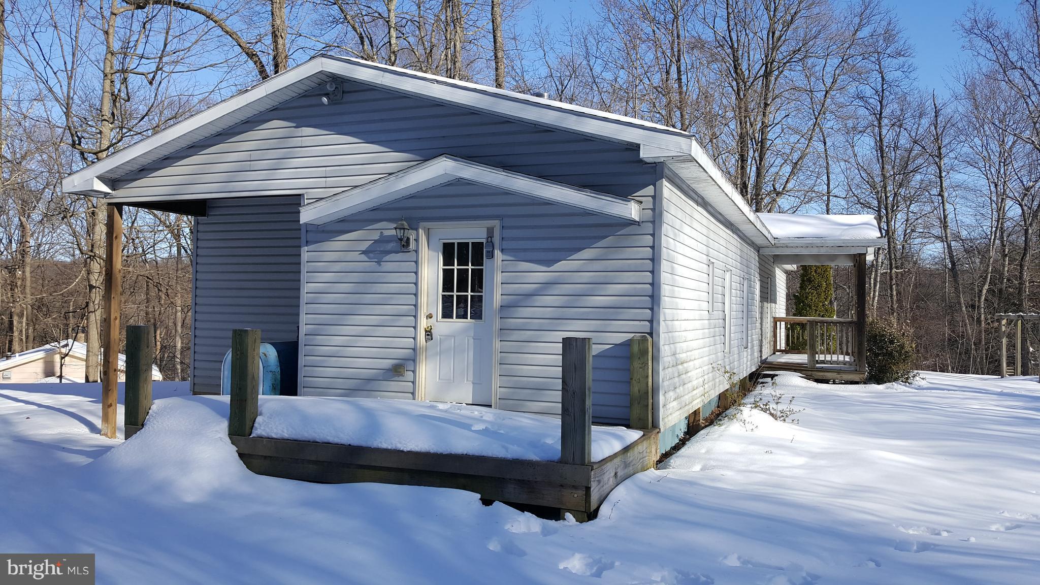 24581 Hells Delight Road Smithsburg, MD 21783 - Photo 2 of 22 a porch with seating space