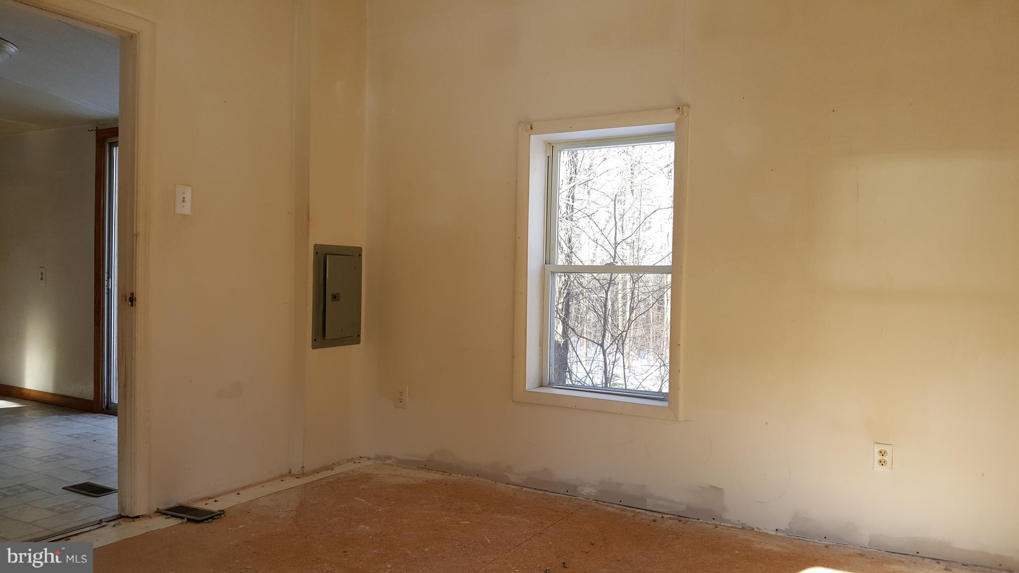 24581 Hells Delight Road Smithsburg, MD 21783 - Photo 12 of 22 an empty room with windows