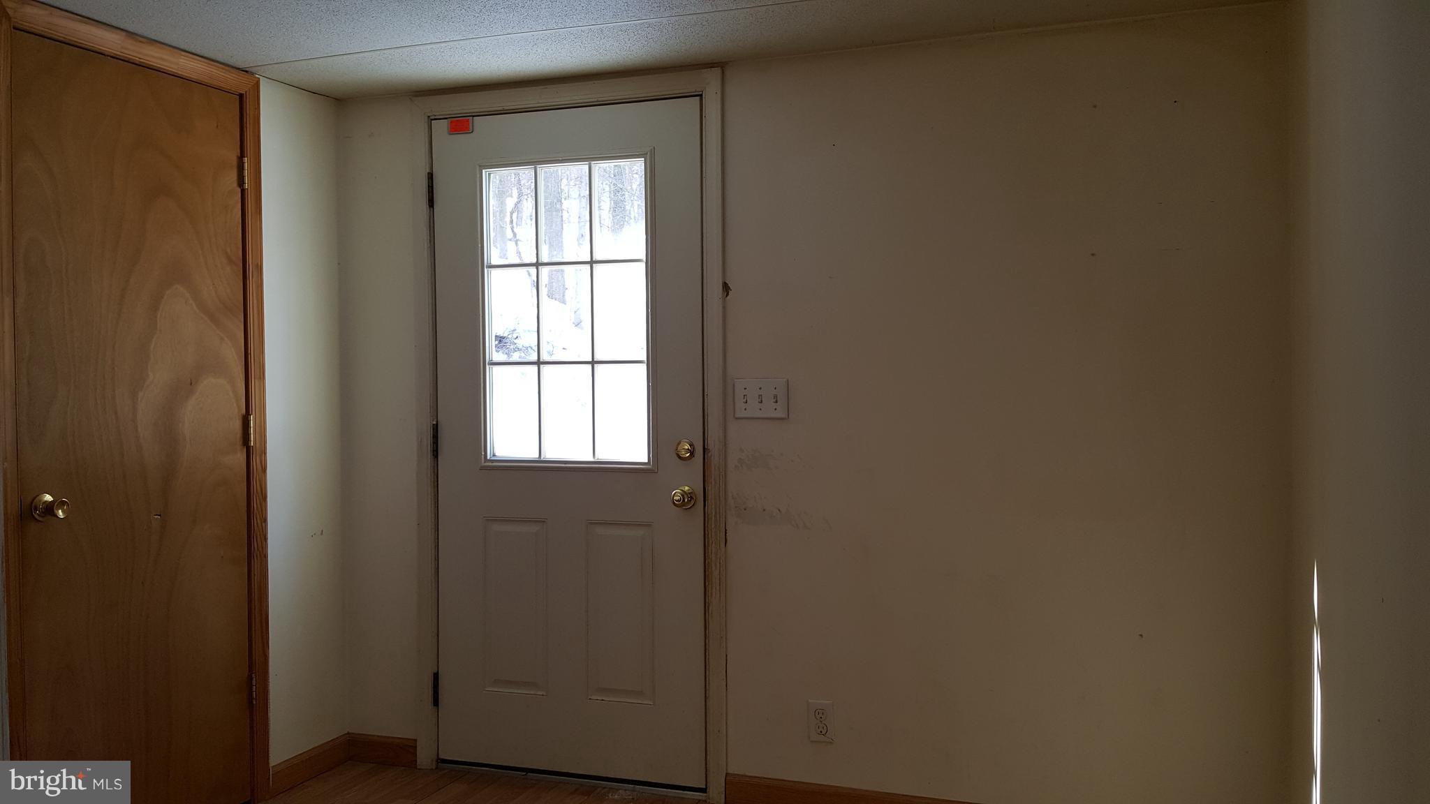 24581 Hells Delight Road Smithsburg, MD 21783 - Photo 21 of 22 a view of front door with wooden floor