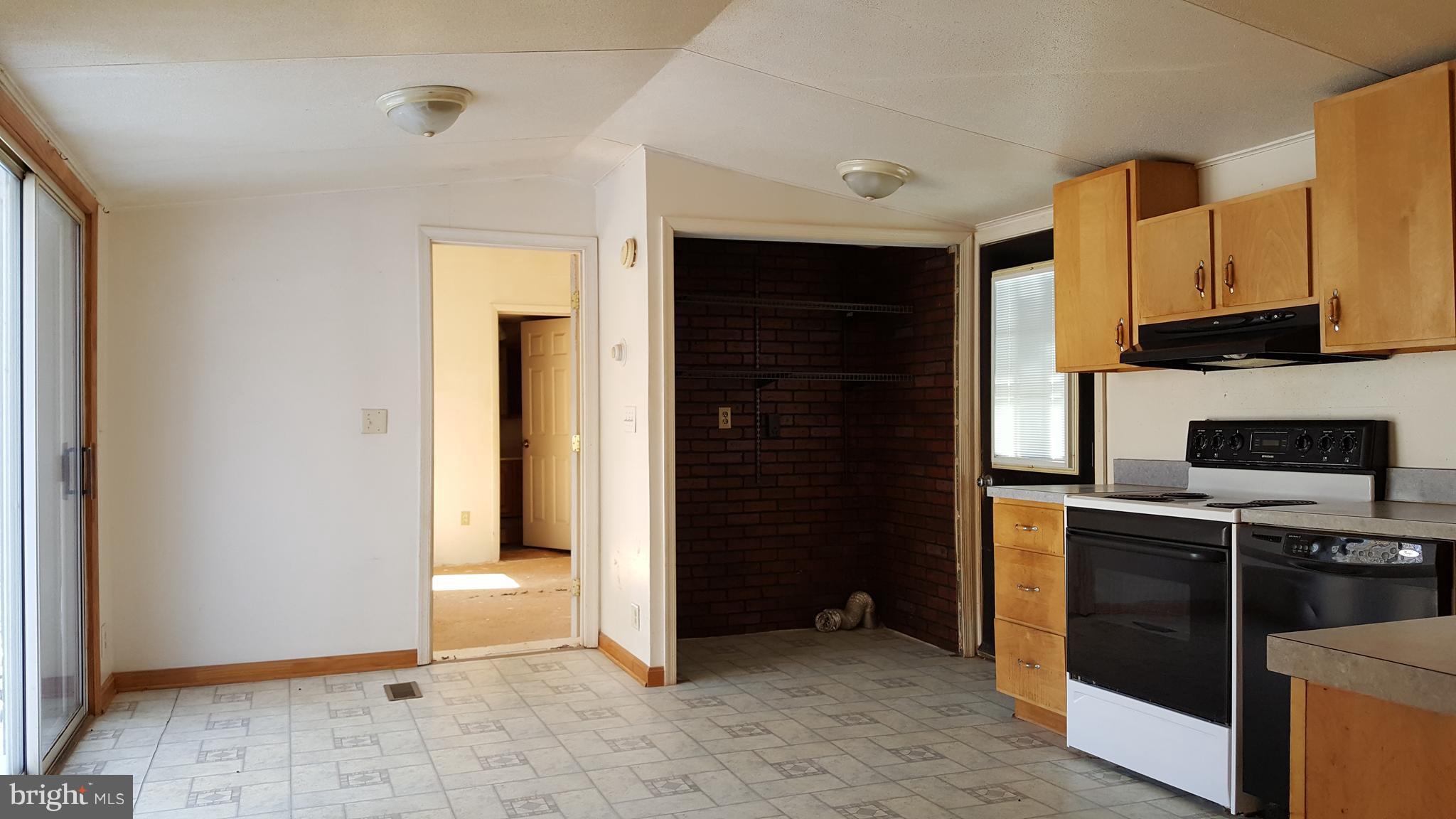 24581 Hells Delight Road Smithsburg, MD 21783 - Photo 9 of 22 a view of a kitchen with electric appliances