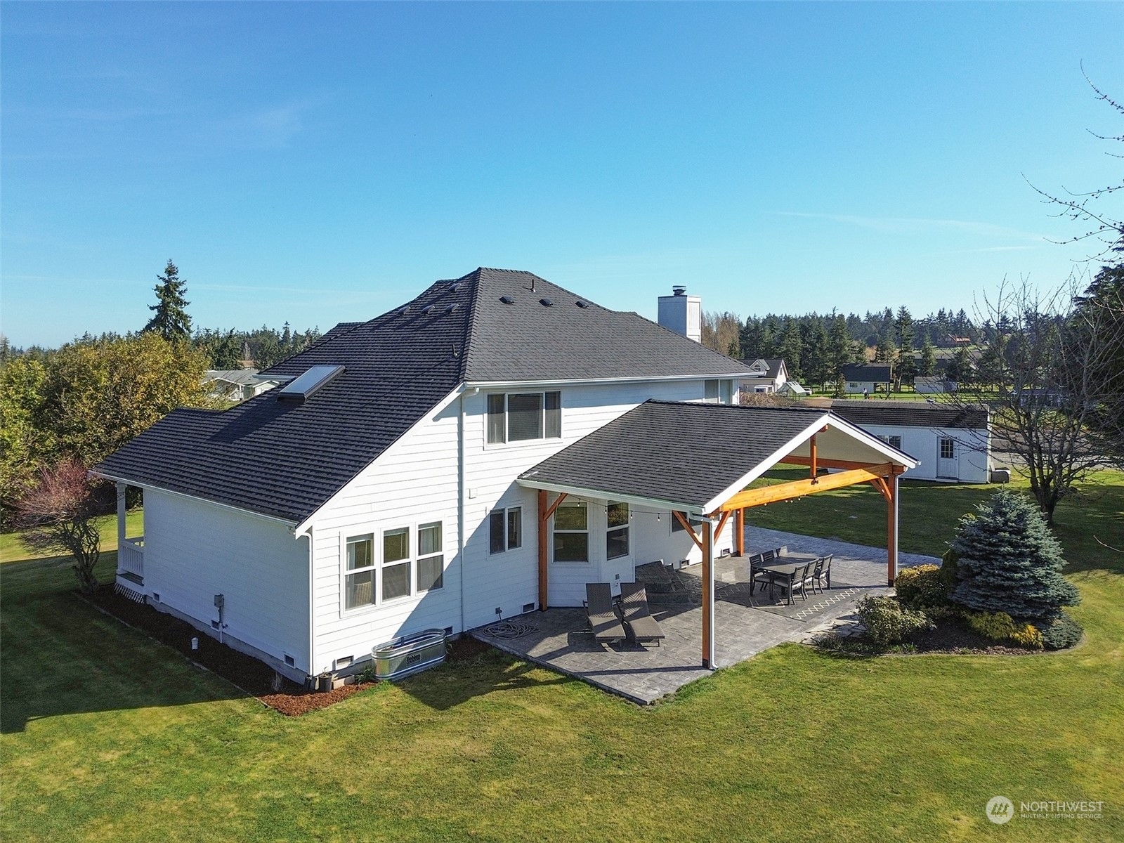 293 Griffith Farm Road Sequim, WA 98382 - Photo 30 of 40 a aerial view of a house with swimming pool and sitting area