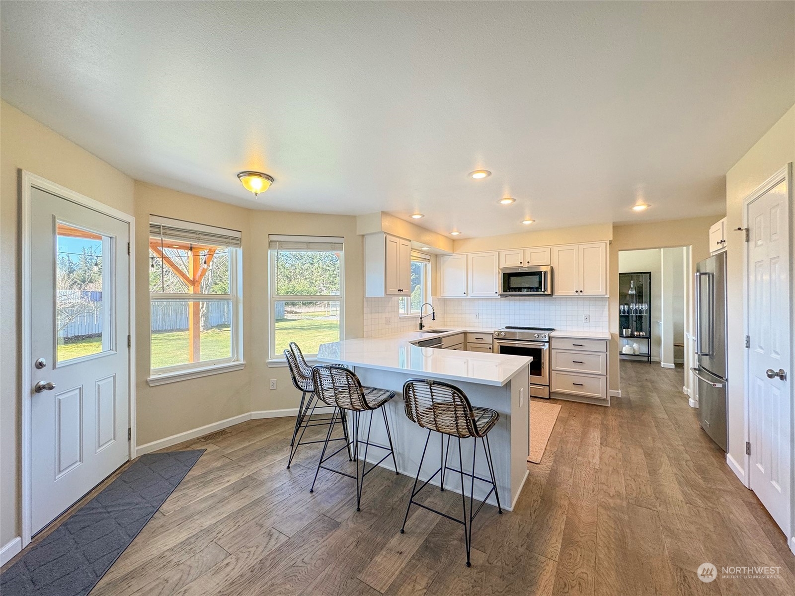 293 Griffith Farm Road Sequim, WA 98382 - Photo 9 of 40 a view of a dining room with furniture window and wooden floor