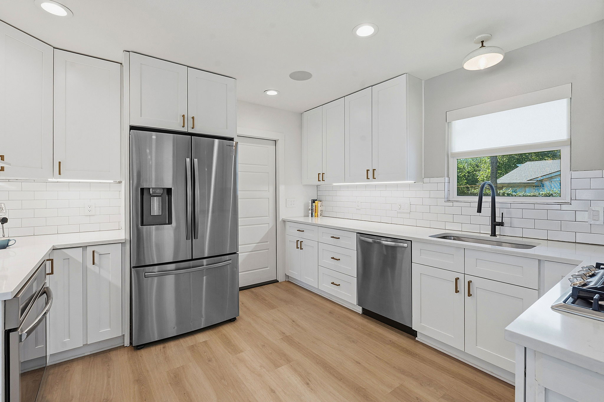 4403 Elmsgrove Drive Austin, TX 78721 - Photo 6 of 38 A pristine culinary space features sleek stainless steel appliances and abundant cabinetry.