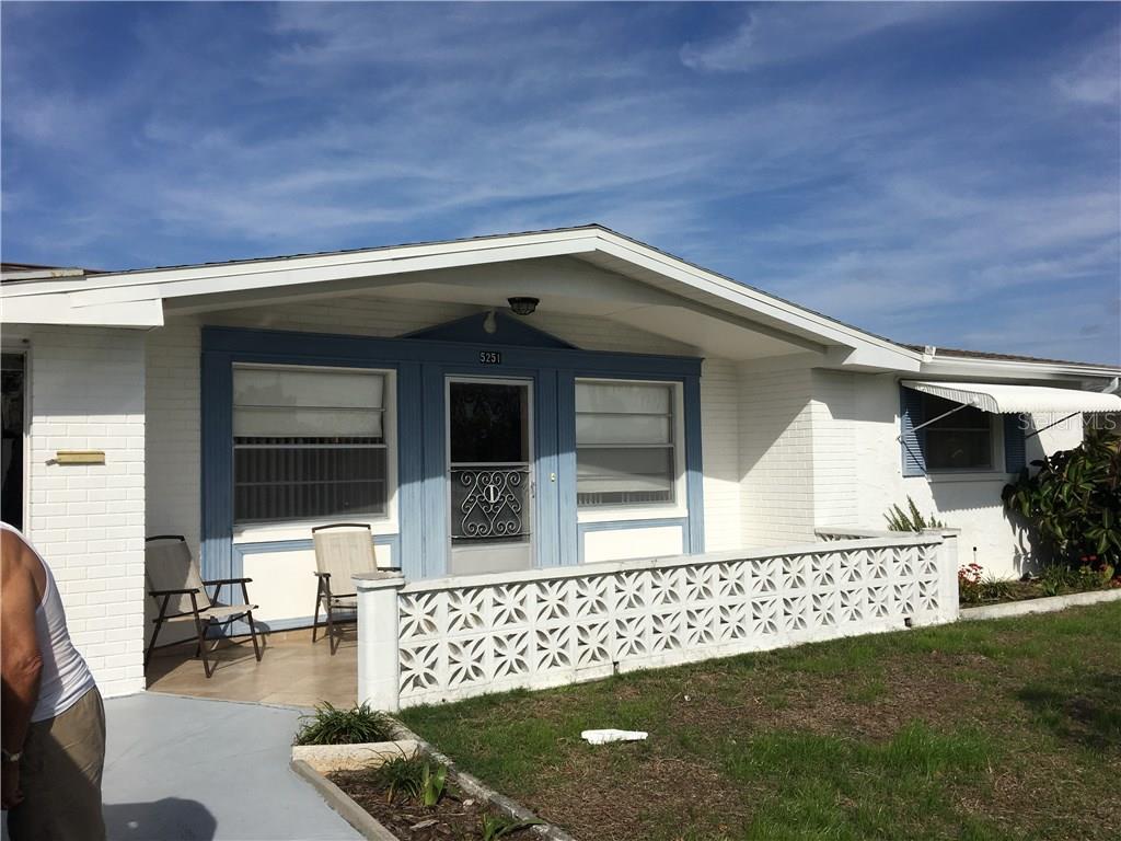5251 Swallow Drive New Port Richey, FL 34652 - Photo 1 of 1 a front view of a house with a yard